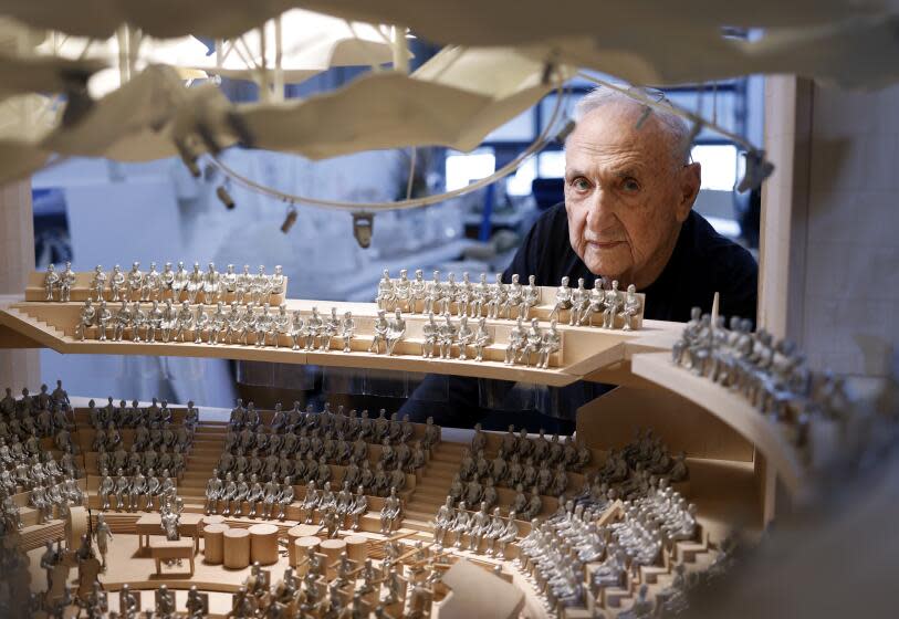 LOS ANGELES-CA-JANUARY 31, 2024: Architect Frank Gehry is photographed with a model of his design for an addition for Colburn School, a private performing arts school in downtown Los Angeles, which will make Bunker Hill the only place with three Gehry-designed buildings in close proximity, on January 31, 2024. (Christina House / Los Angeles Times)