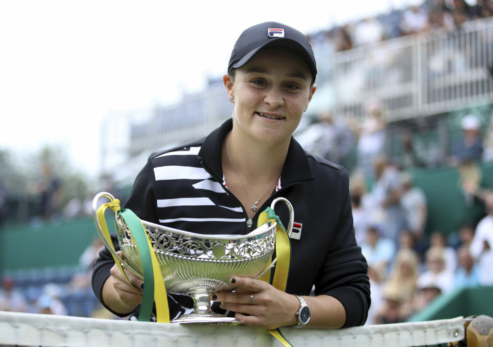 Australia's Ashley Barty poses with the trophy after beating Germany's Julia Goerges during the final match of the Nature Valley Classic at Edgbaston Priory Club in Birmingham, England, Sunday June 23, 2019. (Tim Goode/PA via AP)