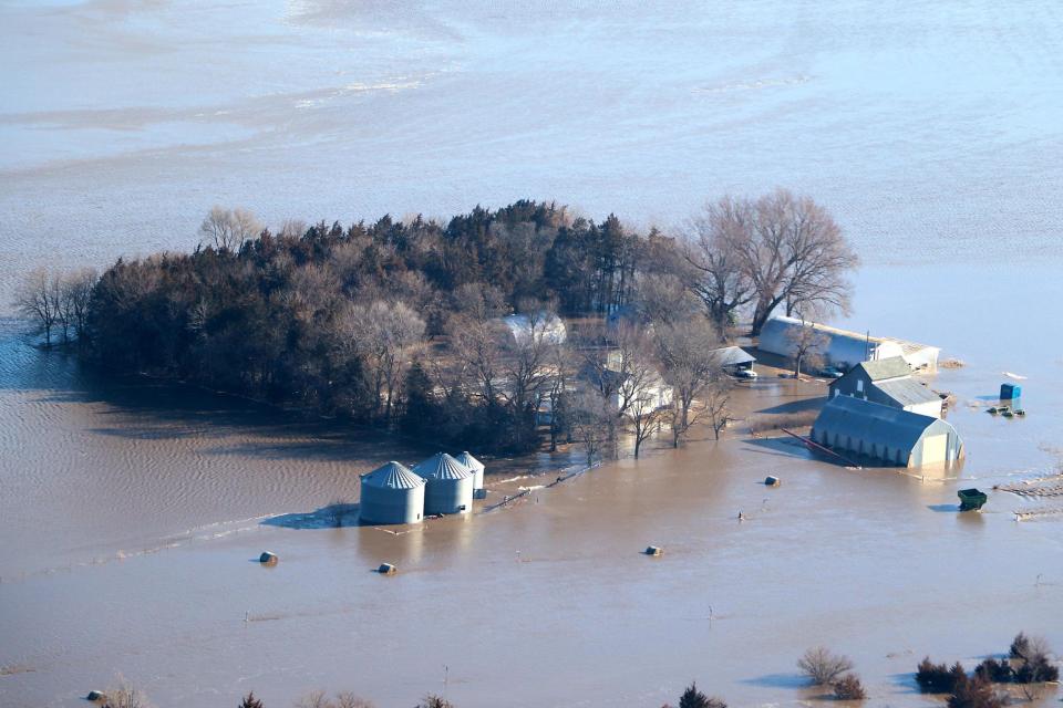 US weather: States reel from historic floods as fresh snow threatens parts of the midwest