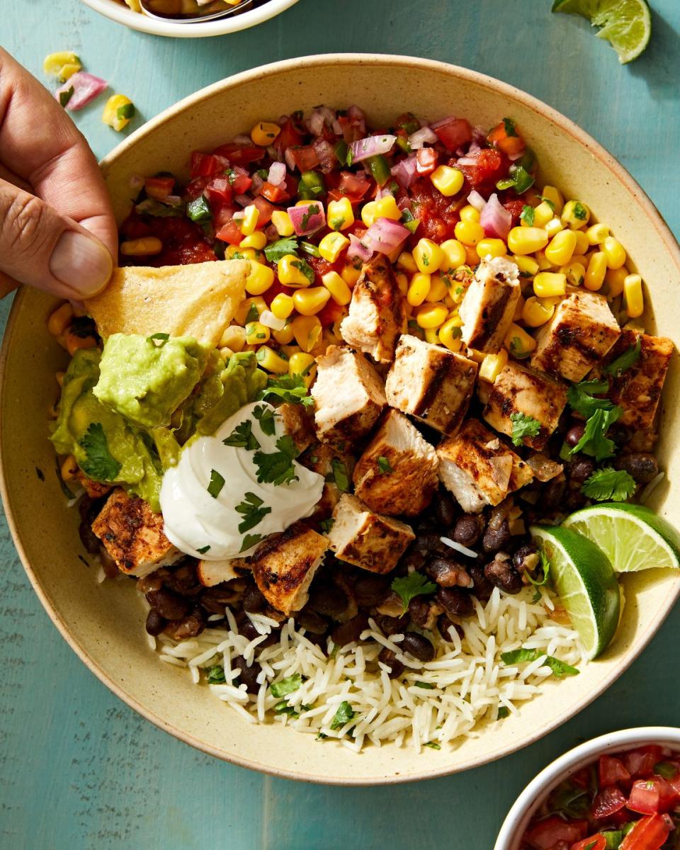 <p>While we’re all about switching things up, when we want a tried-and-true perfect meal, we always go back to Chipotle's chicken <a href="https://www.delish.com/cooking/g2154/burrito-recipes/" rel="nofollow noopener" target="_blank" data-ylk="slk:burrito;elm:context_link;itc:0;sec:content-canvas" class="link ">burrito</a> bowl. It’s classic, reliable, and, best of all, completely customizable depending on our mood. We’ve included recipes here for all our favorite burrito <a href="https://www.delish.com/cooking/g42229861/grain-bowl-recipes/" rel="nofollow noopener" target="_blank" data-ylk="slk:bowl;elm:context_link;itc:0;sec:content-canvas" class="link ">bowl</a> toppings, but feel free to swap them in and out for yours!</p><p>Get the <strong><a href="https://www.delish.com/cooking/a43496223/copycat-chipotle-burrito-bowl-recipe/" rel="nofollow noopener" target="_blank" data-ylk="slk:Copycat Chipotle Burrito Bowl recipe;elm:context_link;itc:0;sec:content-canvas" class="link ">Copycat Chipotle Burrito Bowl recipe</a></strong>.</p>