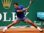 Rafael Nadal of Spain returns the ball to his compatriot David Ferrer during their quarter-final match at the Monte Carlo Masters in Monaco April 18, 2014. REUTERS/Eric Gaillard