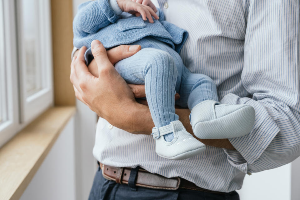 man holding their baby