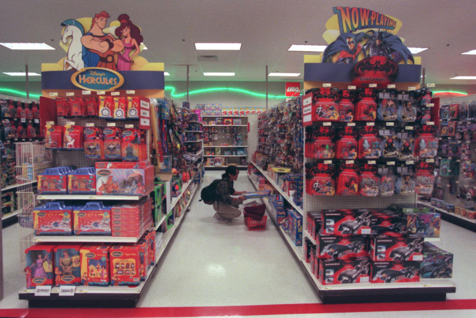 Aisles inside a Target store showing neon green lights on the wall