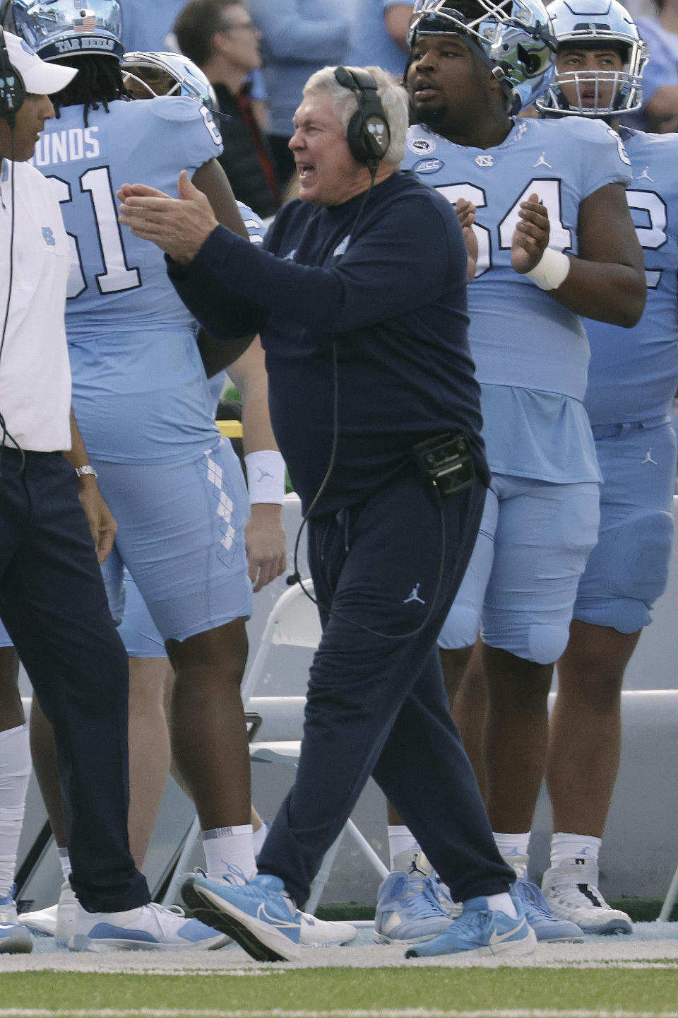 North Carolina head coach Mack Brown cheerts his players after they made a good play during the first half of an NCAA college football game against North Carolina State Friday, Nov. 25, 2022, in Chapel Hill, N.C. (AP Photo/Chris Seward)