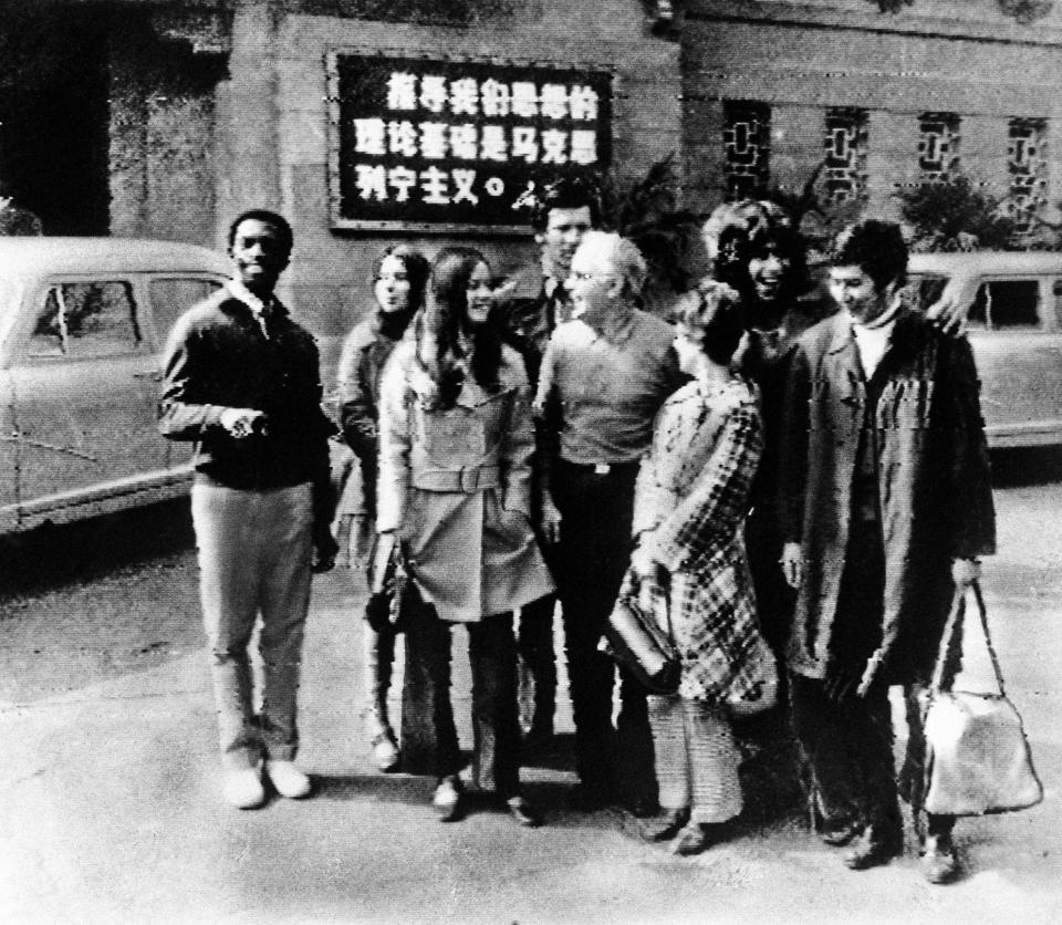 FILE - In this handout, members of the United States table tennis team stand in front of their hotel in Peking, in Communist China, in this Tuesday, April 14, 1971, file photo. From left are: George Braithwaite of Brooklyn, N.Y.; Judy Bochenski of Eugene, Ore.; Olga Soltesz of Orlando, Fla.; Jack Howard of Seattle, Wash.; Graham Stenhoven, president of the United States Table Tennis Association from Detroit; Connie Sweeris of Grand Rapids, Mich.; Glen Cowan of Santa Monica, Calif., and Errol Resek of New York City. Tossed into the middle of a potential thawing in U.S. relations with China, though, Judy Bochenski and her American ping pong teammates helped deliver one of the great diplomatic coups of their time.(AP Photo/File)