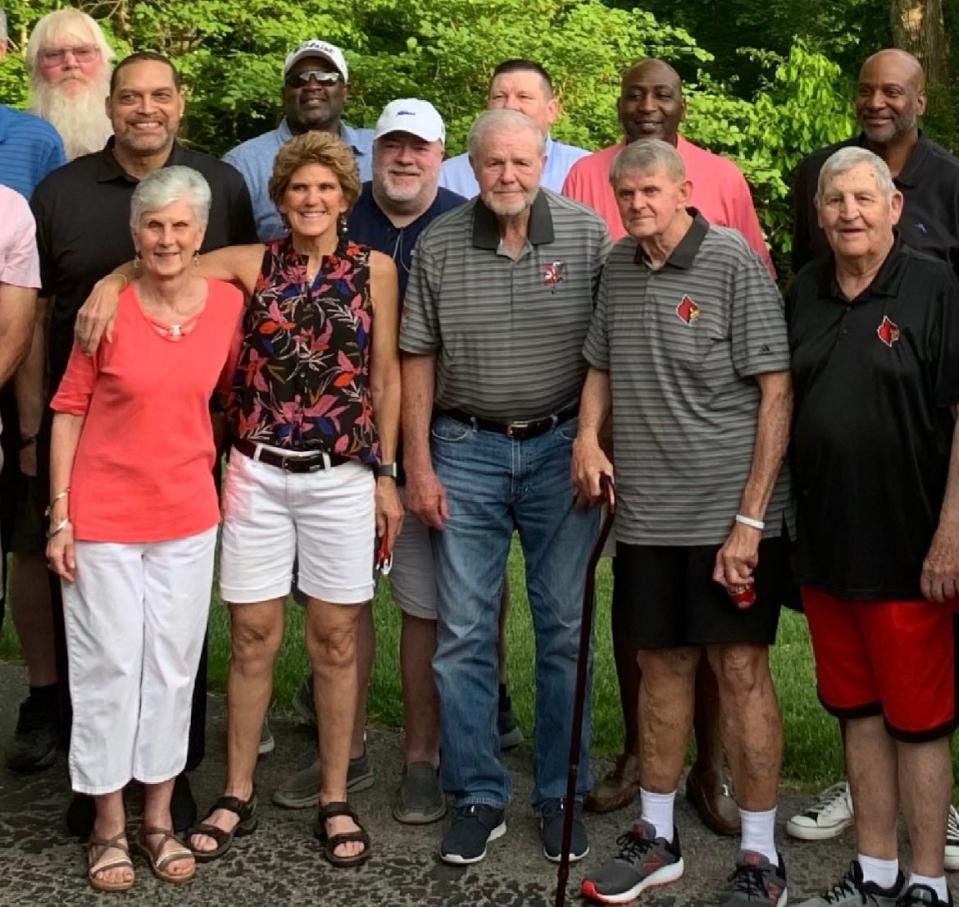 Jerry May, bottom row, second from right, poses for a picture with Hall of Fame Louisville men's basketball head coach Denny Crum, bottom row, middle, during a get-together at Crum's house in Louisville. May, the longtime assistant athletic director for sports medicine at U of L, died Sunday at age 72.