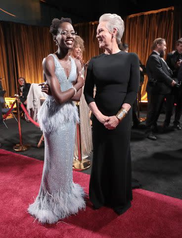 <p>Al Seib/A.M.P.A.S. via Getty</p> Lupita Nyong'o and Jamie Lee Curtis