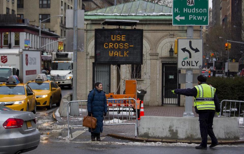 A pedestrian, who quickly after followed instructions, is given direction to a crosswalk by a traffic agent at W. 96th Street and Broadway in the Upper West Side of New York Monday, Jan. 27, 2014. New York Mayor Bill de Blasio, in the wake of 11 pedestrian deaths in the city already in 2014, is taking direct aim at not just drivers but pedestrians, with a crackdown that has resulted in the first jaywalking tickets some residents have ever seen. (AP Photo/Craig Ruttle)