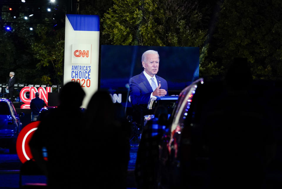 Democratic presidential candidate former Vice President Joe Biden ]is seen on a video screen as he participates in a CNN town hall moderated by Anderson Cooper in Moosic, Pa., Thursday, Sept. 17, 2020. (AP Photo/Carolyn Kaster)