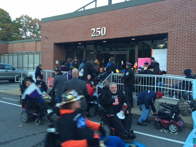 Disability-rights activists jam the entrance of the Judge Rotenberg Center in Canton during a demonstration.