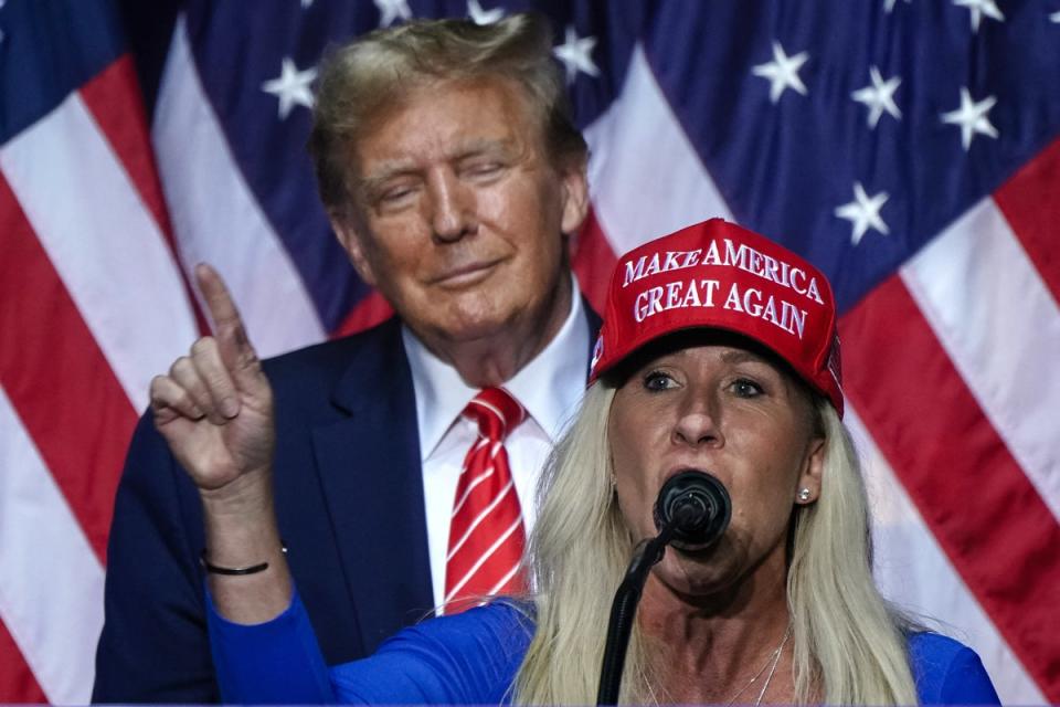Marjorie Taylor Greene speaking alongside Donald Trump at a campaign event in Georgia on 9 March 2024 (AFP via Getty Images)