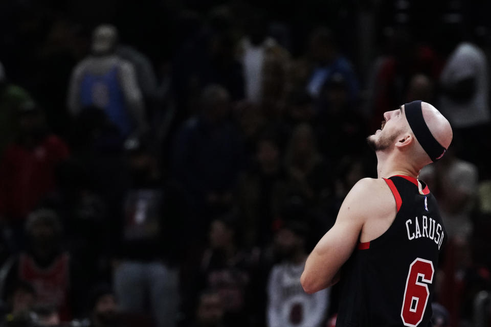 Chicago Bulls guard Alex Caruso looks up at a scoreboard during the second half of an NBA basketball game against the Orlando Magic in Chicago, Friday, Nov. 17, 2023. (AP Photo/Nam Y. Huh)