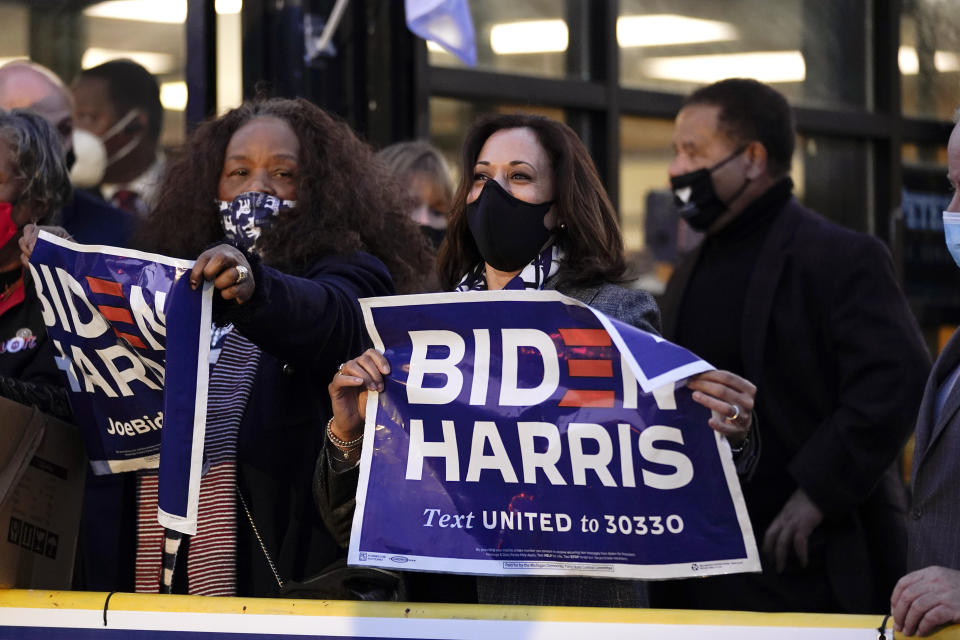 Democratic vice presidential candidate Sen. Kamala Harris, D-Calif. hands out yard signs at the 14th Congressional District Office in Detroit, Tuesday, Sept. 22, 2020. (AP Photo/Paul Sancya)