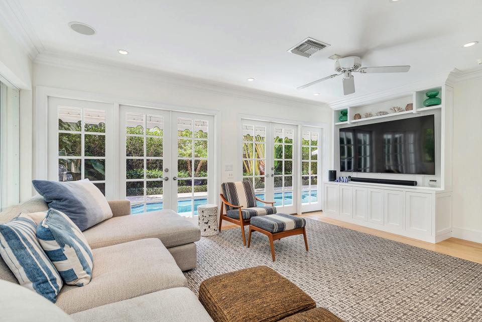 A bank of French doors in the family room opens to the pool deck.