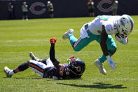 Miami Dolphins running back Myles Gaskin, right, is tackled by Chicago Bears cornerback Duke Shelley during the first half of an NFL preseason football game in Chicago, Saturday, Aug. 14, 2021. (AP Photo/Nam Y. Huh)