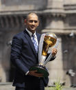 FILE - In this Sunday, April 3, 2011, file photo, Indian cricket captain Mahendra Singh Dhoni poses with the World Cup trophy in front of the Gateway of India monument, in Mumbai, India. India great Dhoni announced his retirement from international cricket on Saturday, Aug. 15, 2020. Under Dhoni’s stewardship, India won the T20 World Cup in 2007, the 50-over World Cup in 2011 and the Champions Trophy in 2013. (AP Photo/Gurinder Osan, File)