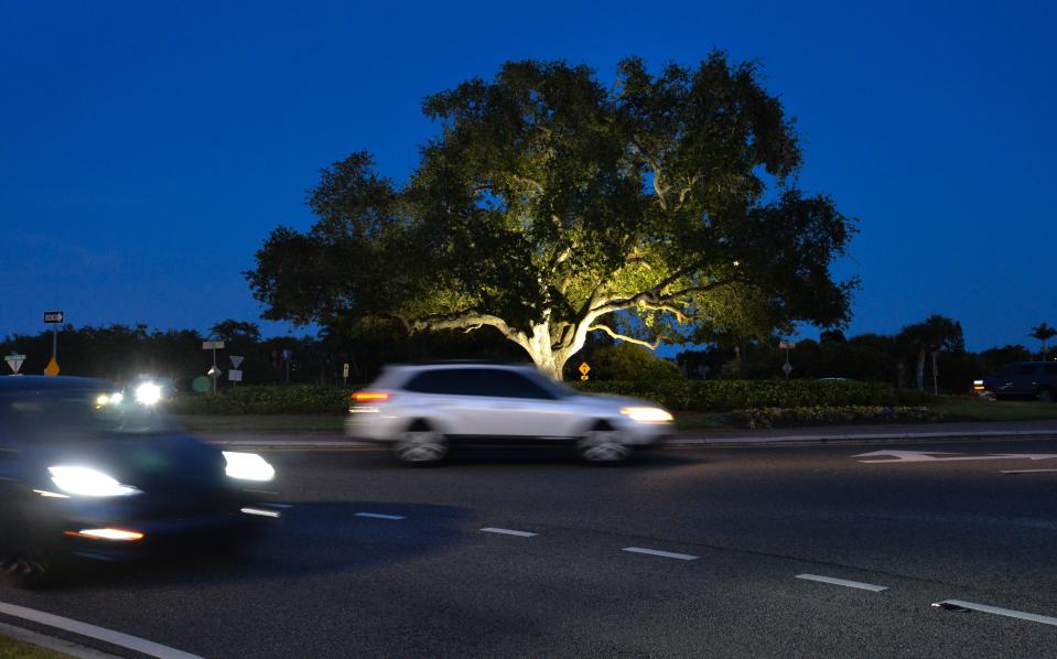 A vehicle traverses the Viera roundabout near sundown at Wickham Road and Lake Andrew Drive.