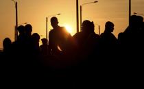 Venezuelan migrants stand on the Pan-American Highway outside an immigration office in an attempt to cross from Ecuador into Peru after stricter entry requirements went into effect, in Tumbes, Peru, Saturday, June 15, 2019. With its relatively stable economy and flexible immigration laws, Peru has become a main destination for millions of Venezuelans escaping hyperinflation, medical shortages and political repression at home. (AP Photo/Martin Mejia)