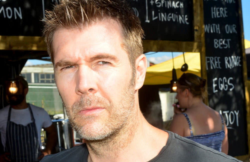 Rhod Gilbert has admitted he’s 'lucky to be here' after being diagnosed with cancer credit:Bang Showbiz