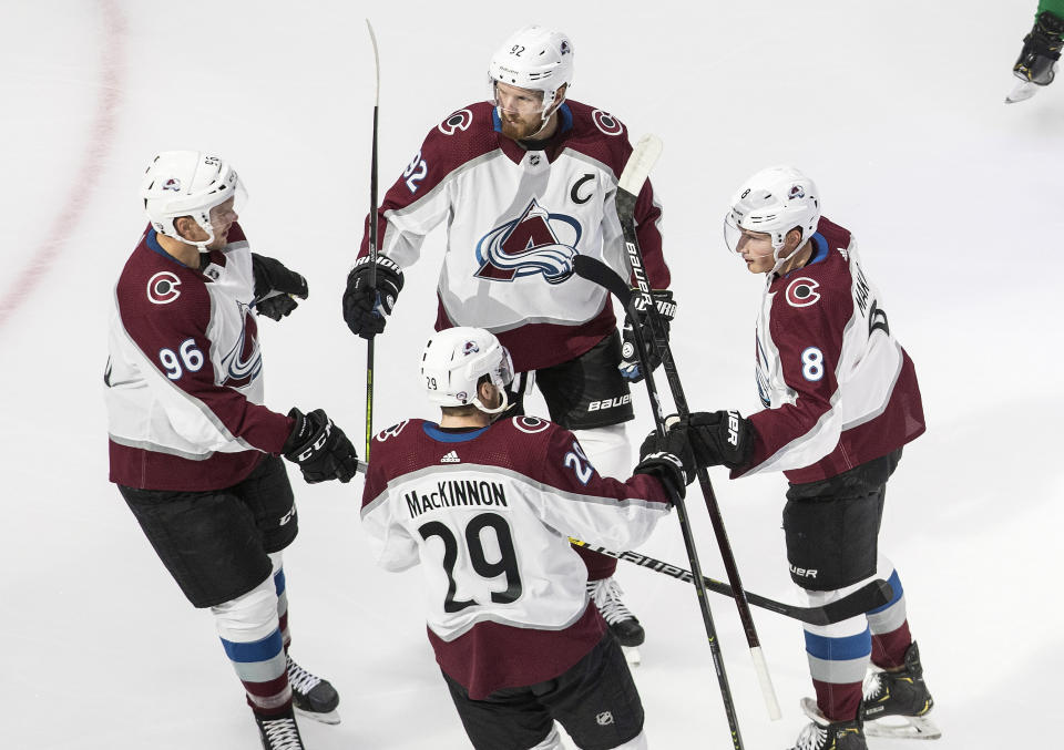 Colorado Avalanche players celebrate a goal against the Dallas Stars during the first period of an NHL hockey playoff game Wednesday, Aug. 5, 2020 in Edmonton, Alberta. (Jason Franson/The Canadian Press via AP)