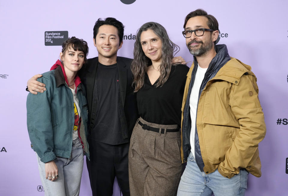 Sam Zuchero, second from right, and her husband Andy Zuchero, right, co-writers and co-directors of "Love Me," pose with cast members Kristen Stewart, left, and Steven Yeun at the premiere of the film at Eccles Theatre during the 2024 Sundance Film Festival, Friday, Jan. 19, 2024, in Park City, Utah. (AP Photo/Chris Pizzello)