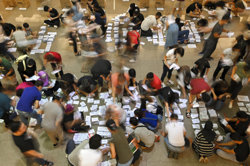 Volunteers sort postal ballots from overseas on the eve of the Malaysian general election in Kuala Lumpur on Nov. 18, 2022.