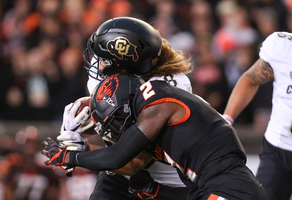 Colorado tight end Brady Russell (38) collides with Oregon State defensive back Rejzohn Wright (2) during the second quarter at Reser Stadium in Corvallis, Ore. on Saturday, Oct. 22, 2022.
