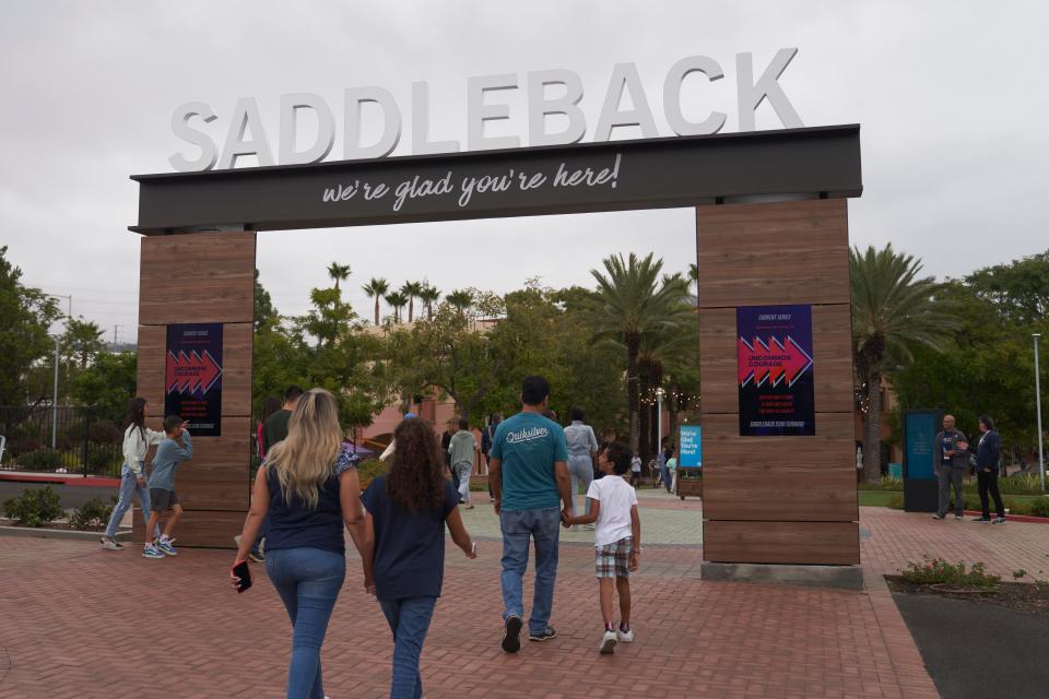 Congregants arrive to hear Pastor Andy Wood give a sermon on Sunday, Oct. 16, 2022, at Saddleback Church in Lake Forest, Calif. Wood was recently announced as founding Pastor Rick Warren's successor to the church, which is the second largest in the Southern Baptist Convention, regularly drawing in about 2,500 people with more online every Sunday. (AP Photo/Allison Dinner)