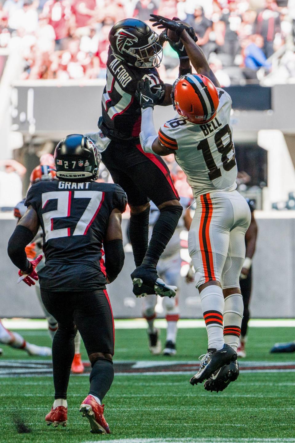 Atlanta Falcons cornerback Dee Alford (37) picks off the ball against Cleveland Browns wide receiver David Bell (18) during the second half of an NFL football game against the Cleveland Browns, Sunday, Oct. 2, 2022, in Atlanta. The Atlanta Falcons won 23-20. (AP Photo/Danny Karnik)