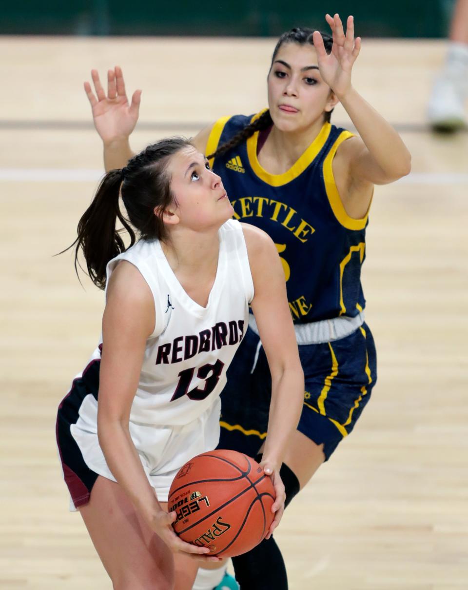 De Pere senior guard Claire Bjorge (13) has flourished this season after missing her junior year with a torn anterior cruciate ligament.