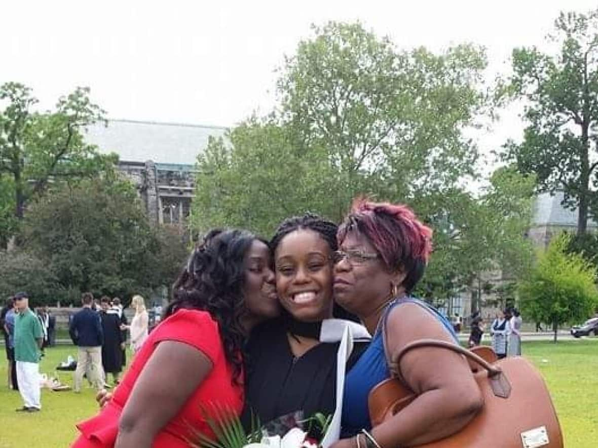 Arielle Townsend, centre, at her graduation from the University of Toronto with her grandmother Susan, right, and mother Nichola, left. (Submitted by Arielle Townsend - image credit)