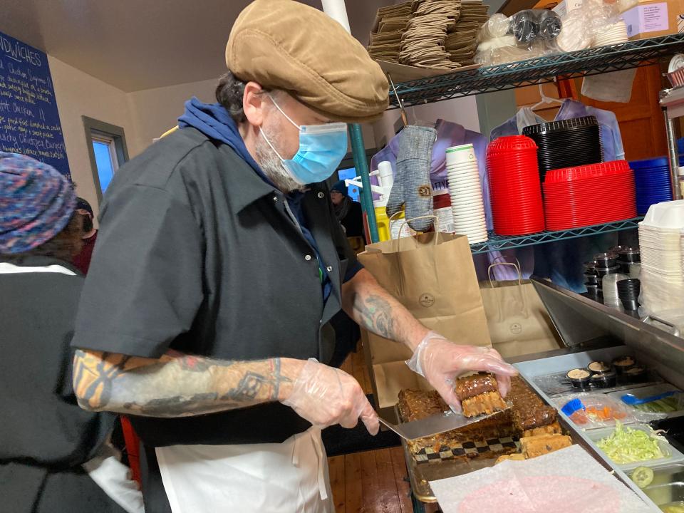 Corey Cayton doles out a pumpkin spice brownie Jan. 13, 2022 at My Favorite Things on Main St. in Jeffersonville.