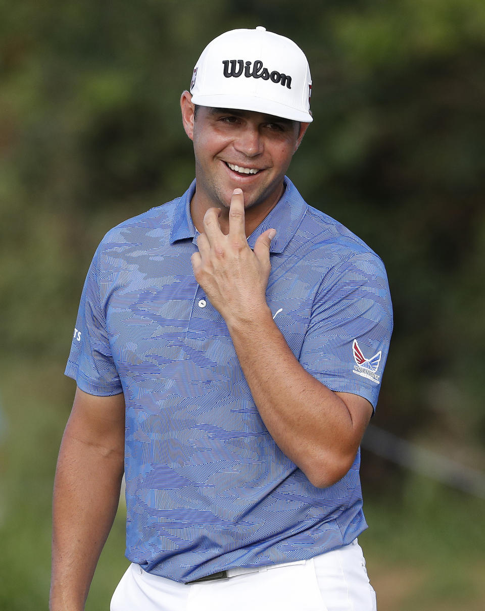 Gary Woodland reacts to missing birdie on the 14th green during the final round of the Tournament of Champions golf event, Sunday, Jan. 6, 2019, at Kapalua Plantation Course in Kapalua, Hawaii. (AP Photo/Matt York)