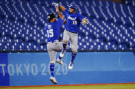 Israel's Danny Valencia celebrates with coach Nate Fish after hitting a two run home run during the eight inning of a baseball game against the Dominican Republicat the 2020 Summer Olympics, Tuesday, Aug. 3, 2021, in Yokohama, Japan. (AP Photo/Matt Slocum)