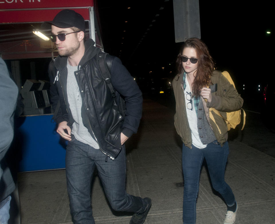 Robert Pattinson and Kristen Stewart arrive at JFK airport on November 26, 2012 in New York City.