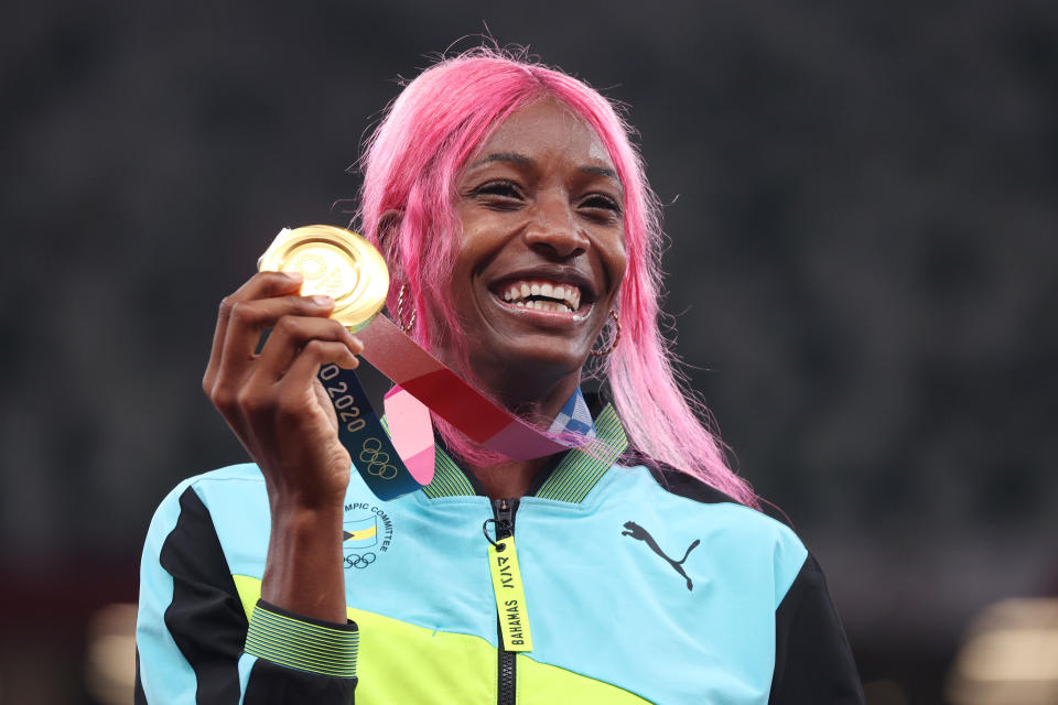 Shaunae Miller-Uibo of Team Bahamas holds up her gold medal