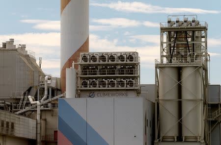 A facility for capturing CO2 from air of Swiss Climeworks AG is placed on the roof of a waste incinerating plant in Hinwil, Switzerland July 18, 2017. REUTERS/Arnd Wiegmann