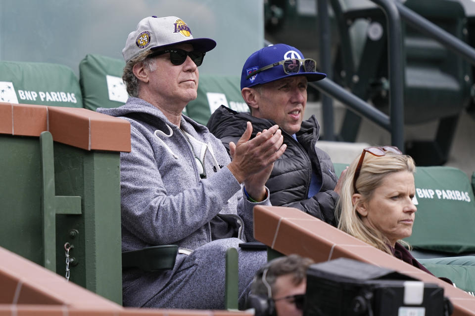 Actor Will Ferrell, top left, watches Marta Kostyuk, of Ukraine, play Anastasia Potapova, of Russia, during a quarterfinal match at the BNP Paribas Open tennis tournament, Thursday, March 14, 2024, in Indian Wells, Calif. (AP Photo/Mark J. Terrill)