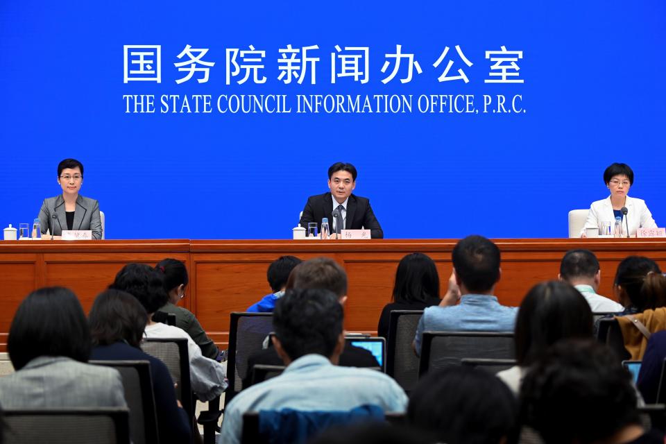 Yang Guang (C) and Xu Luying (R), spokespersons for mainland China's Hong Kong and Macao Affairs Office (HKMAO) of the State Council, attend a press conference in Beijing concerning the ongoing protests in Hong Kong on July 29, 2019. (Photo by WANG ZHAO / AFP)        (Photo credit should read WANG ZHAO/AFP/Getty Images)