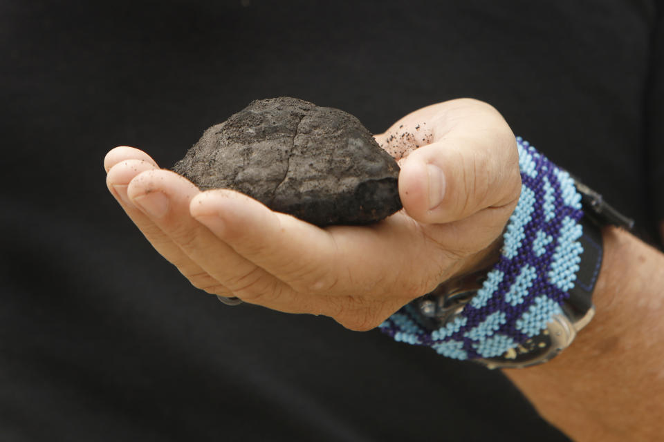 Gerard Barron, Chairman and CEO of The Metals Company, holds a nodule brought up from the sea floor, San Diego, June 8, 2021 (Carolyn Cole / Los Angeles Times via Getty Images)