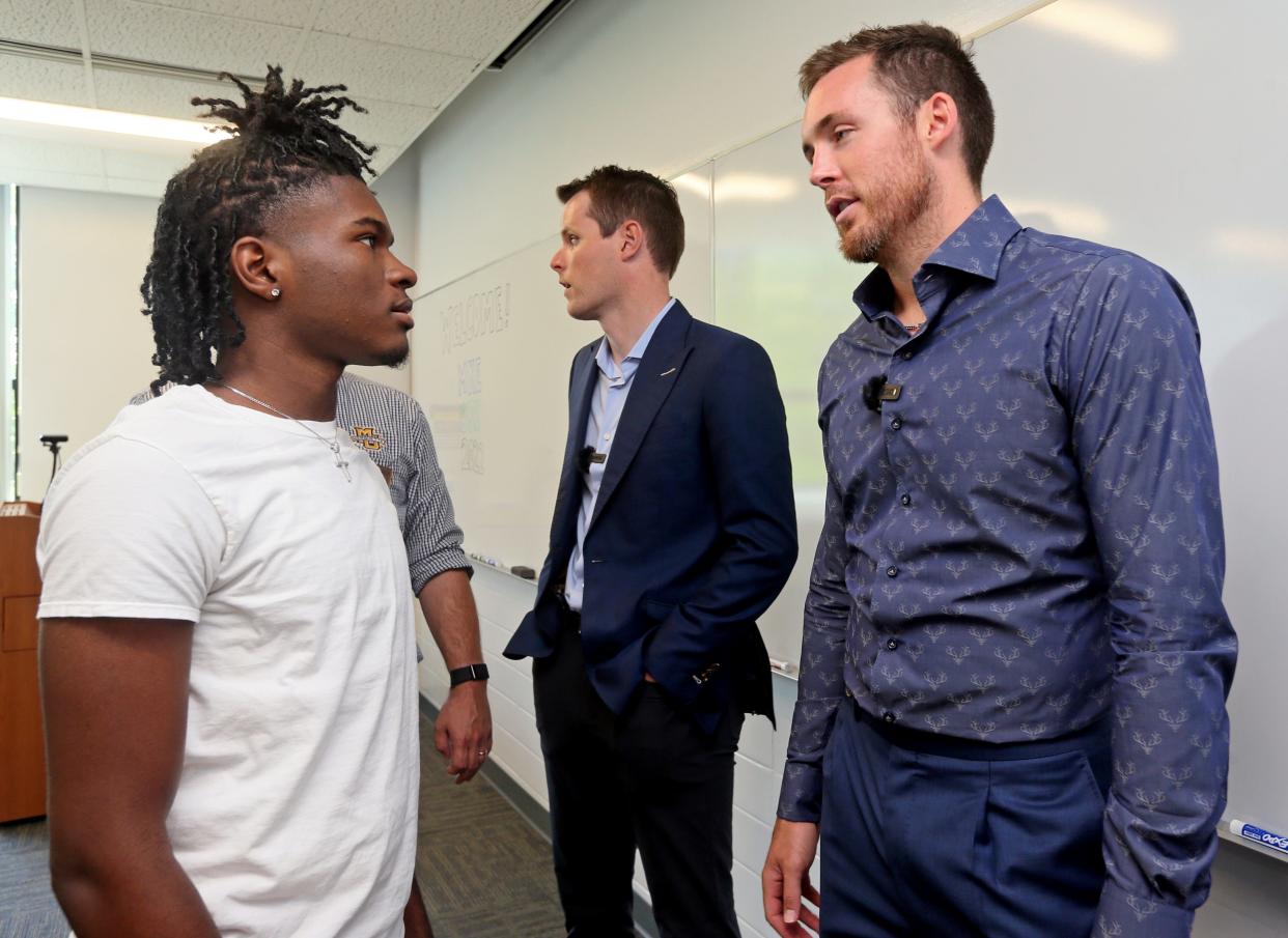 Miles Campbell, 17, left, talks with Milwaukee Bucks player Pat Connaughton, right,  while participating in the NAIOP Wisconsin and Marquette University Center for Real Estate Launch MKE CRE Immersion Program on Monday,  July 18, 2022 at Marquette University. Connaughton was representing his firm Three Leaf Development along with Joe Stanton, center) also with the company.