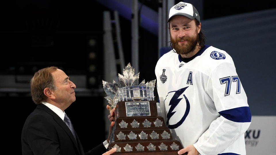 EDMONTON, ALBERTA - SEPTEMBER 28: NHL Commissioner Gary Bettman presents the Conn Smythe Trophy to Victor Hedman #77 of the Tampa Bay Lightning after Game Six of the NHL Stanley Cup Final between the Tampa Bay Lightning and the Dallas Stars at Rogers Place on September 28, 2020 in Edmonton, Alberta, Canada. (Photo by Dave Sandford/NHLI via Getty Images)