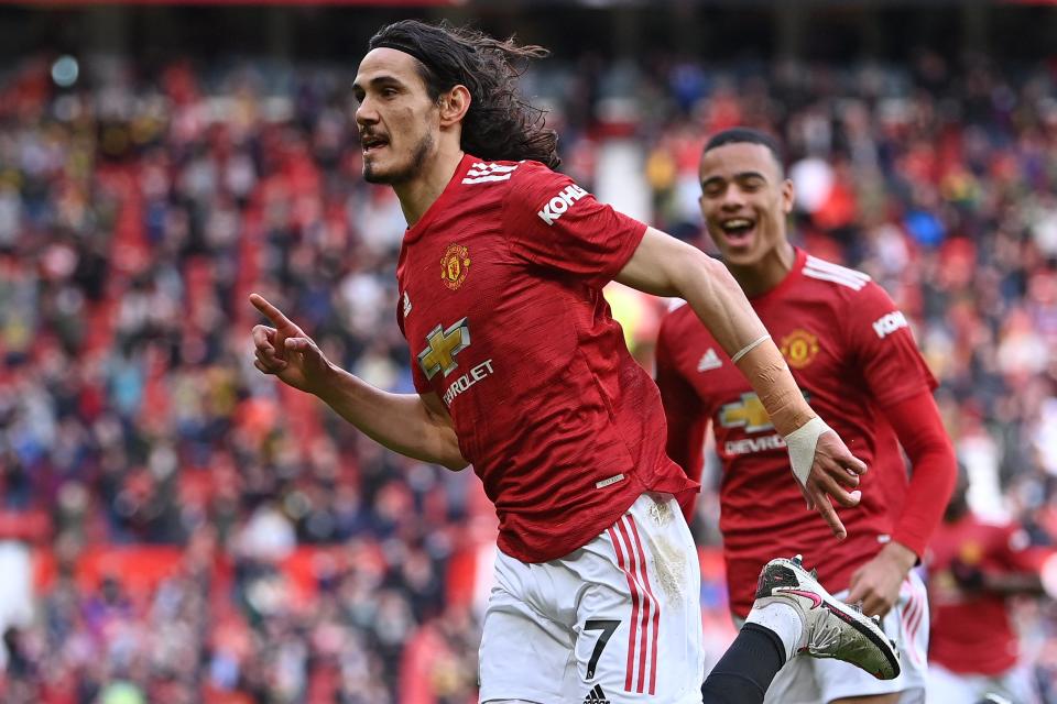 Edinson Cavani celebrates scoring a stunning lobPOOL/AFP via Getty Images