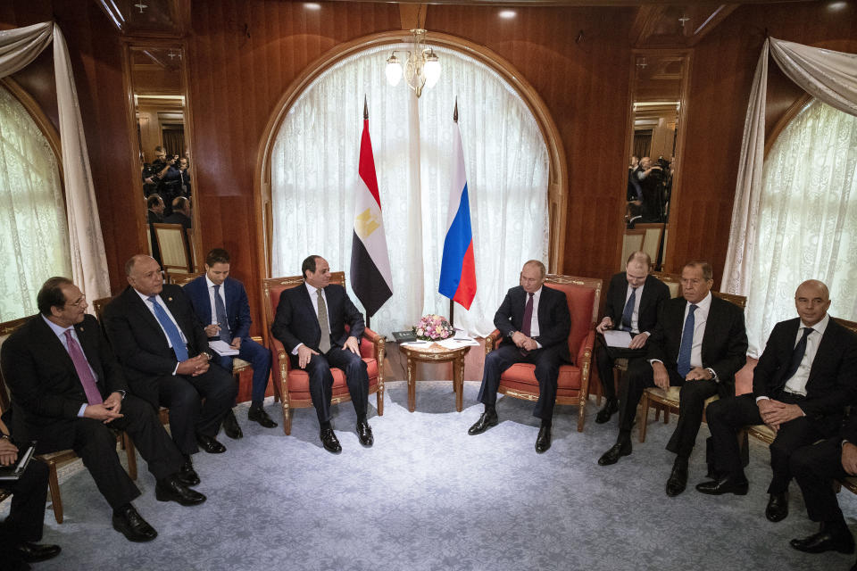 Russian President Vladimir Putin, center right, and Egyptian President Abdel-Fattah el-Sisi, center left, talk during their meeting in Sochi, Russia, Wednesday, Oct. 17, 2018. (AP Photo/Pavel Golovkin, Pool)