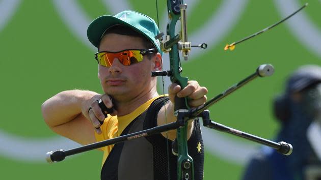 Alec Potts competes in archery.