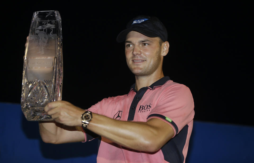 Martin Kaymer of Germany, holds The Players championship trophy at TPC Sawgrass, Sunday, May 11, 2014 in Ponte Vedra Beach, Fla. (AP Photo/Lynne Sladky)