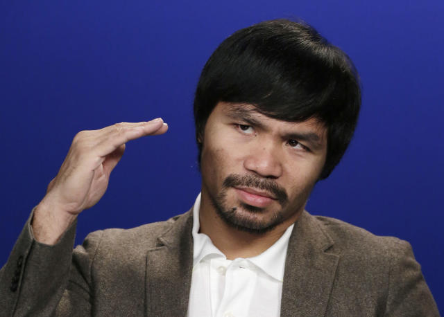 Manny Pacquiao says he wants to fight Floyd Mayweather and that it's not about the money. (AP)