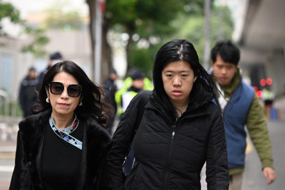 Teresa Lai (left), wife of Jimmy Lai, and their daughter Claire Lai Choi and son Lai Shun Yan arrive at the West Kowloon Court in Hong Kong (AFP/Getty)