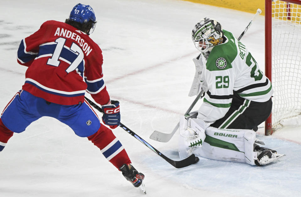 Montreal Canadiens' Josh Anderson tries to tip the puck past Dallas Stars goaltender Jake Oettinger during second period NHL hockey action in Montreal, Canada, Saturday, Feb. 10, 2024. (Graham Hughes/The Canadian Press via AP)