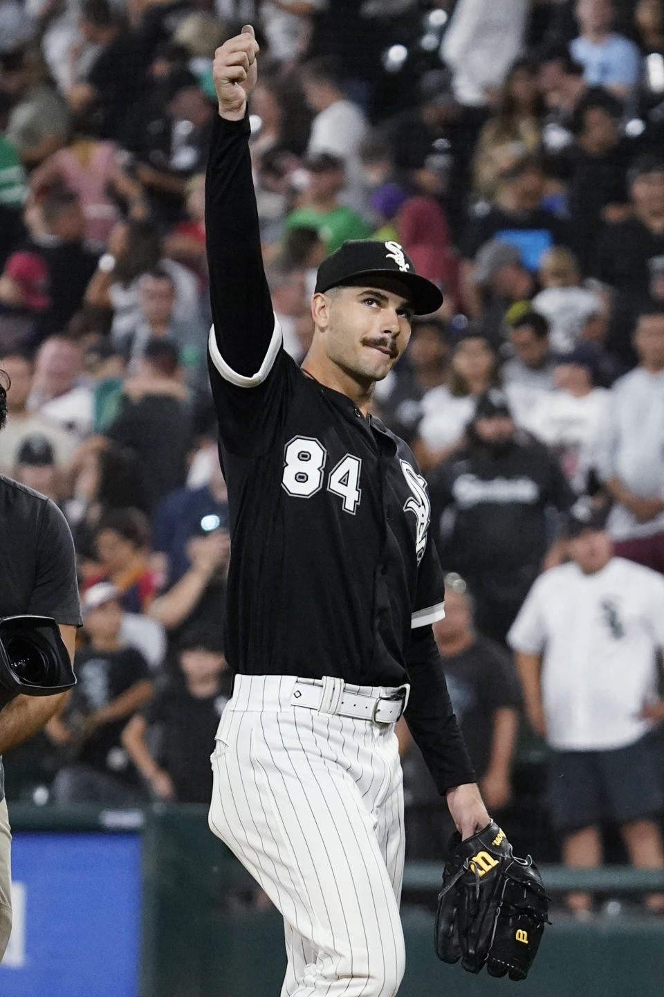 Chicago White Sox starting pitcher Dylan Cease gives a thumbs-up as he leaves the field after his team defeated the Minnesota Twins in a baseball game in Chicago, Saturday, Sept. 3, 2022. (AP Photo/Nam Y. Huh)